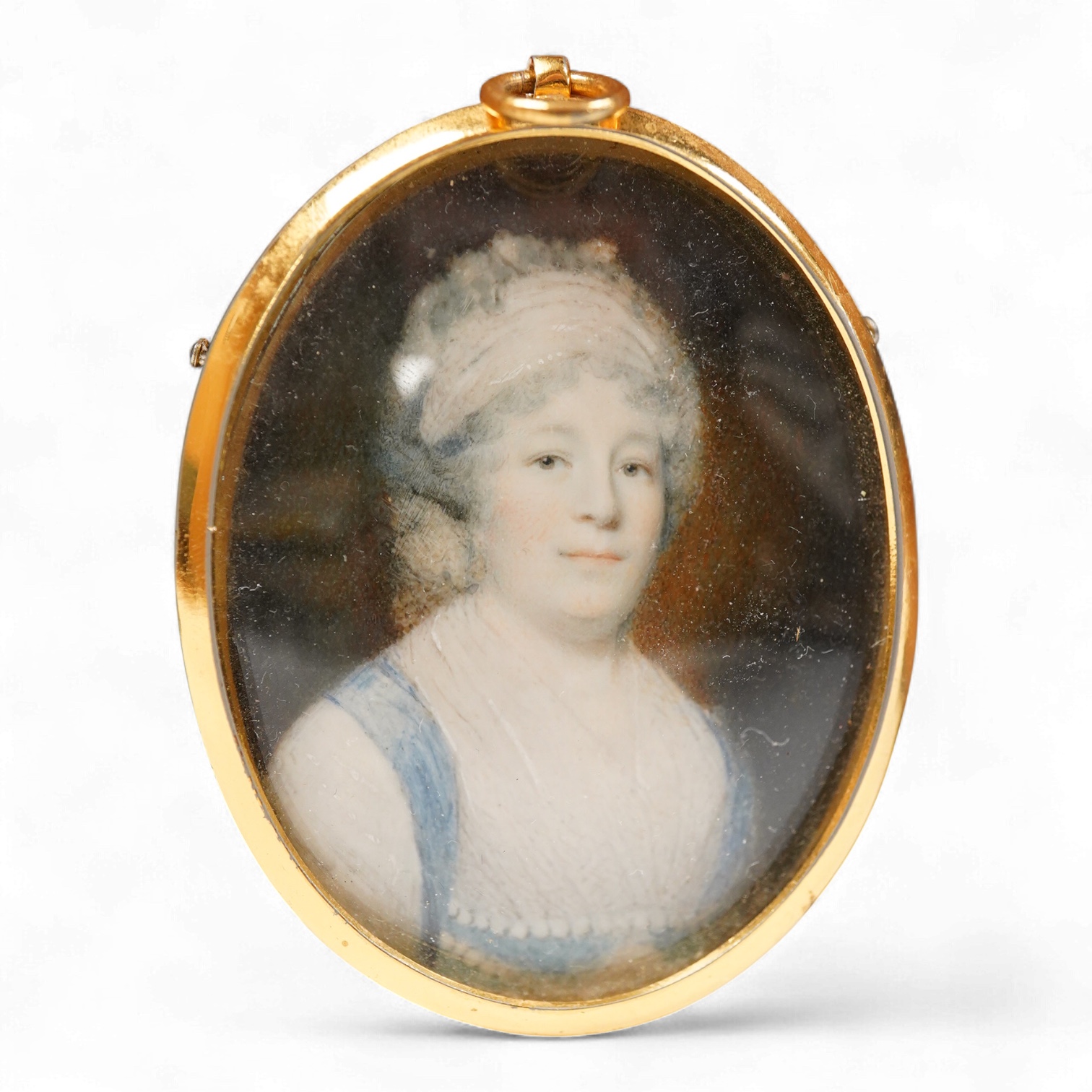 Continental School, 19th century, Portrait miniature of a lady, oval watercolour on ivory, housed in a gilt metal pendant frame, 5.5 x 4cm CITES Submission reference K37C54UF